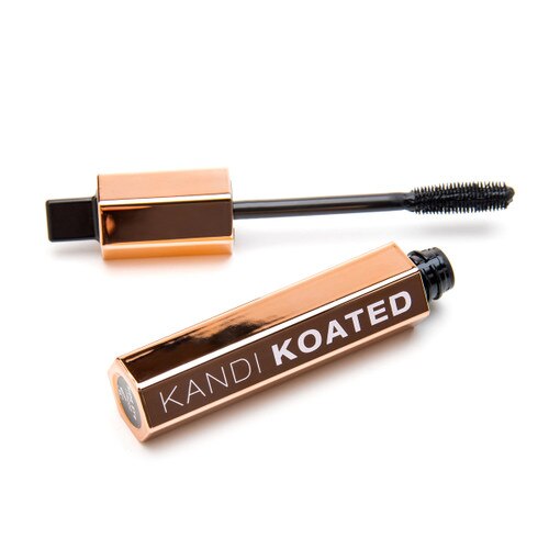 An image of the open drama mascara tube and its applicator brush on a white background.