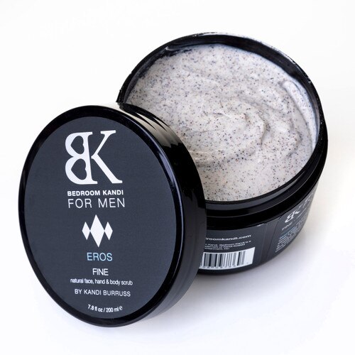 An overhead image of an open jar of the BK for Men Fine face scrub with the lid beside it. The off-white mixture with an exfoliating texture is visible within the container.
