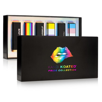 An image of the Kandi Koated Pride Lipstick collection box; the black lid with rainbow lips sits in front of the interior of the box, containing 6 lipsticks in a rainbow shimmer interior