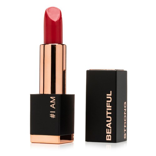 An open tube of Pretty Powerful “Authentic” lipstick with the cap beside it. Authentic is a vibrant, true red. The tube reads “#I Am” with words “Beautiful” and “Strong” on the cap.