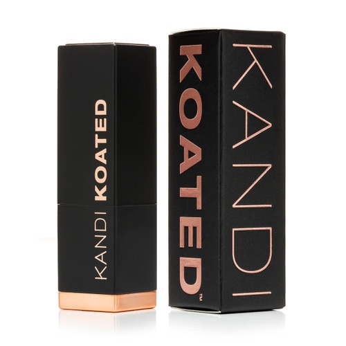 A closed black and rose gold tube of Kandi Koated Suede lipstick with the black and rose gold box beside it.